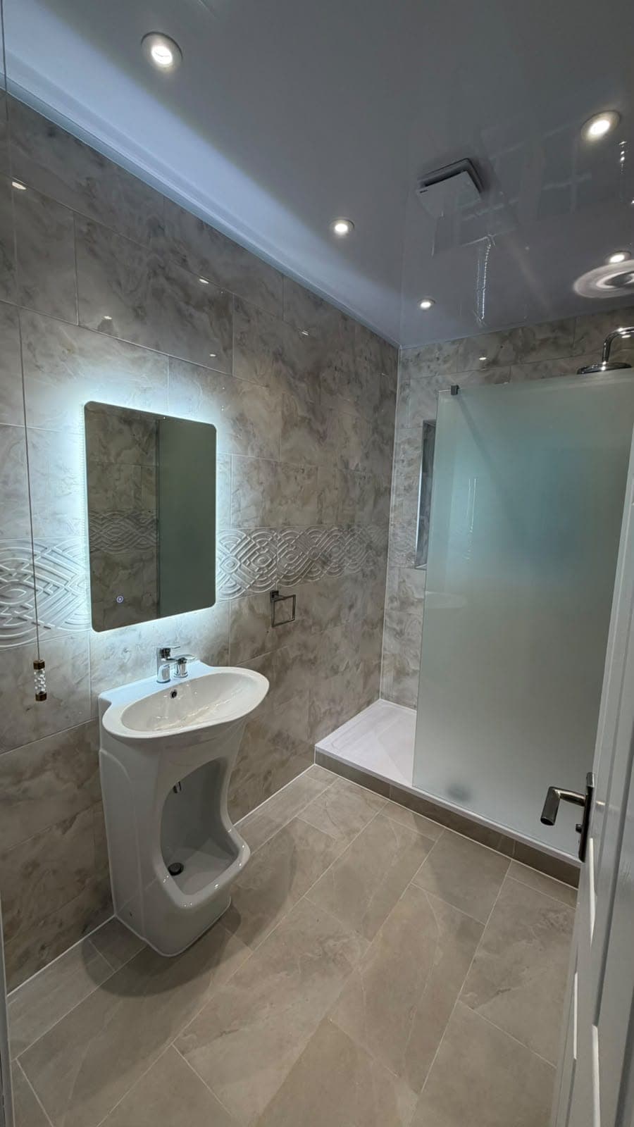 Pedestal basin with backlit mirror and frosted glass shower screen